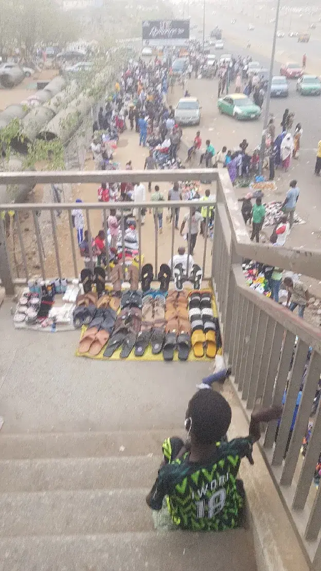 Commuters at a major bus stop in Abuja